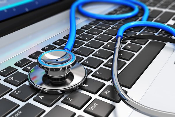 reimage utility software repair software laptop keyboard with stethoscope on it